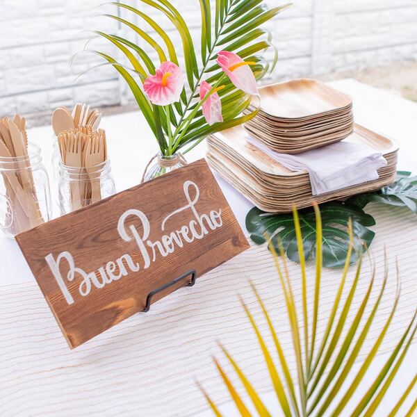 Hand-lettered Buen Provecho sign at a Cuban-themed party